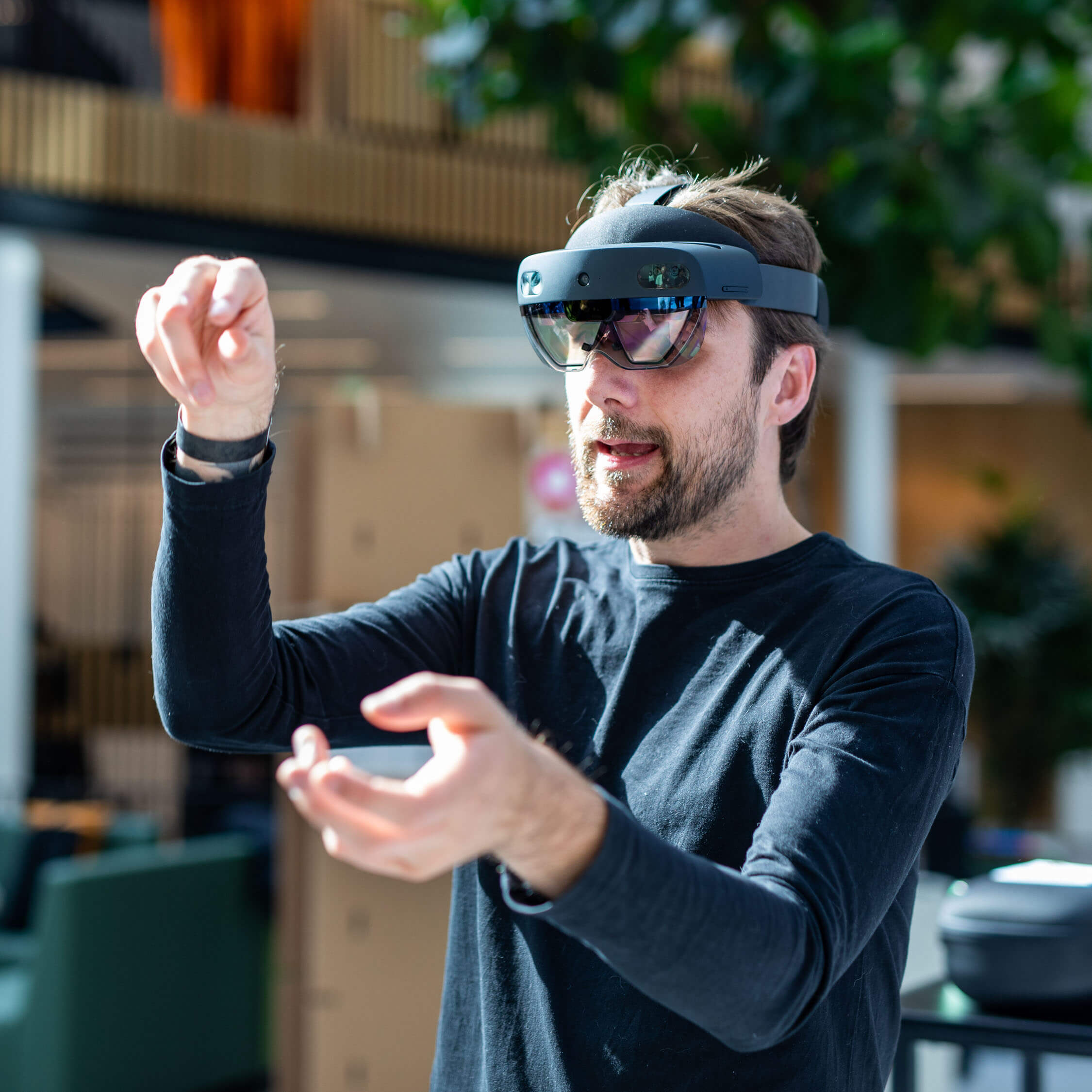A man with a virtual reality headset moving his hands